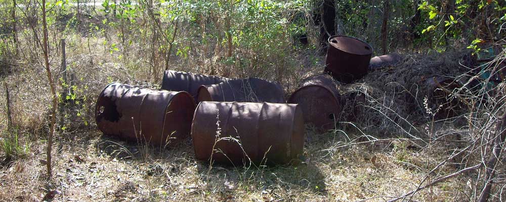 Petrol drums on contaminated site