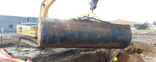Removing a fuel storage tank from the Masters site